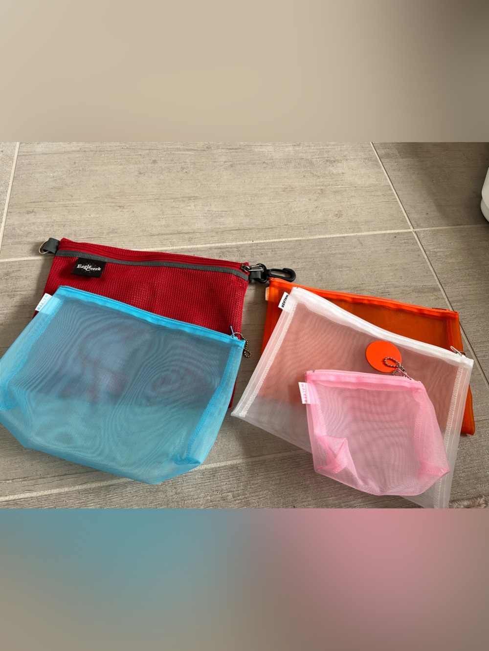 Four Walker Zippered Cases, One Eagle Creek zippered Case